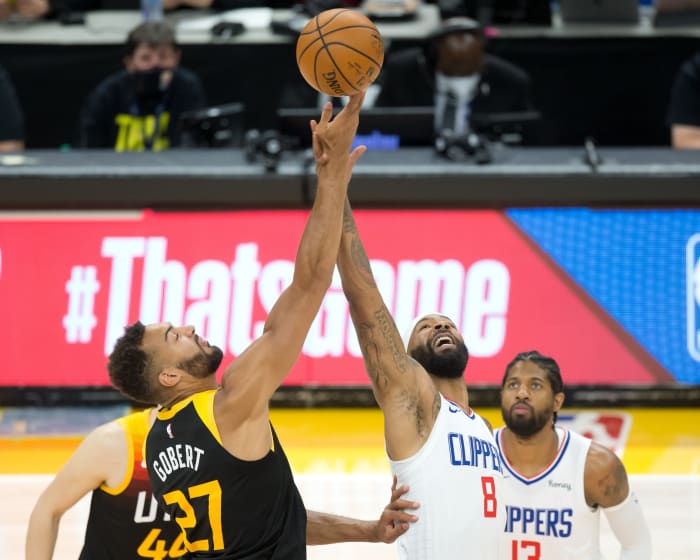 Rudy Gobert (27) and Marcus Morris (8) tip things off in game five on Wednesday night